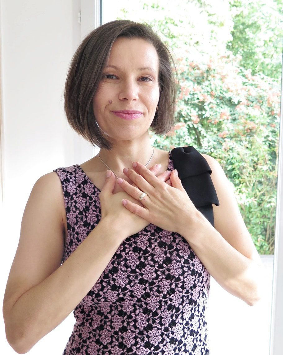 Dorela iEPAN with her hands on her heart