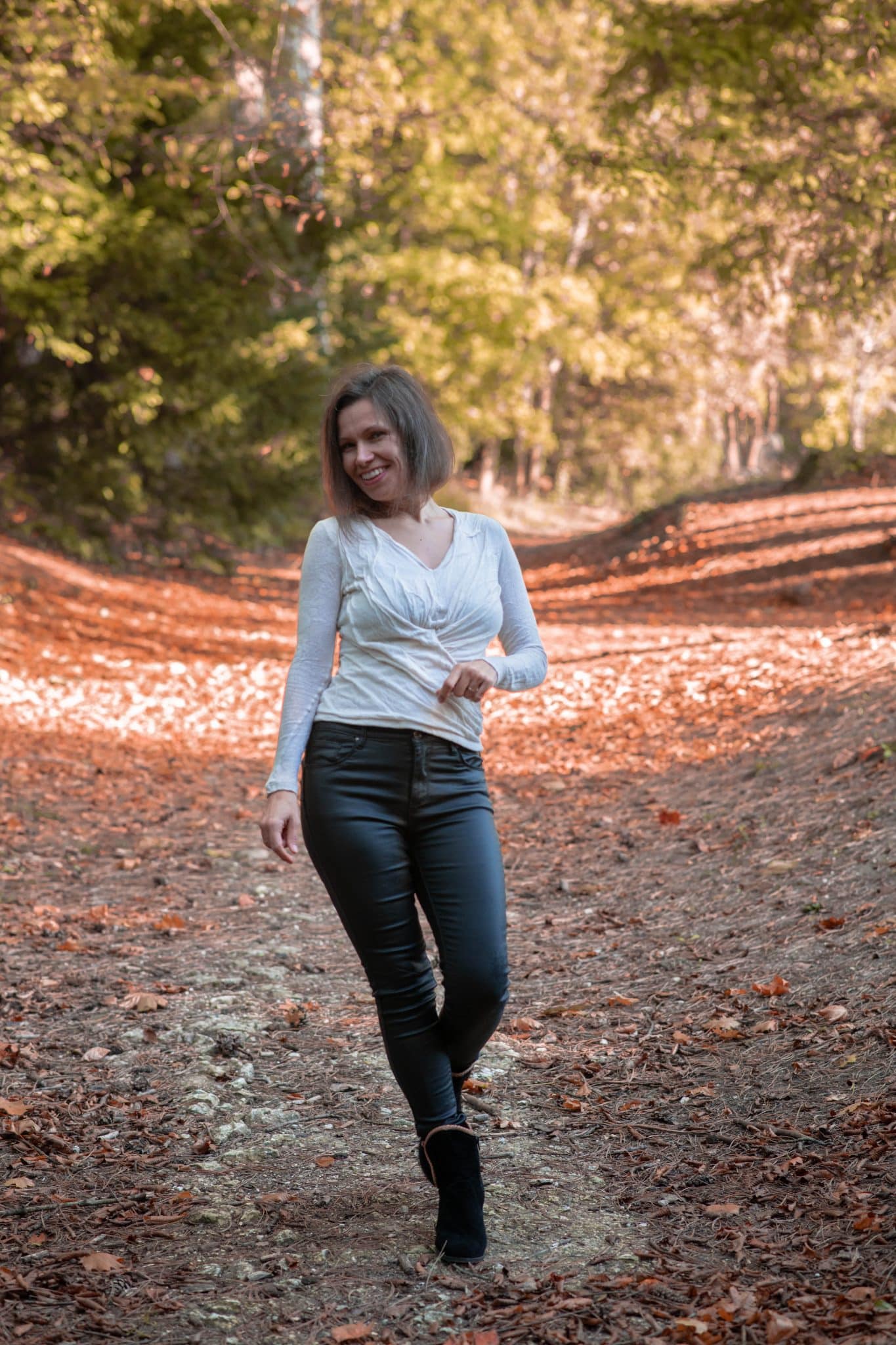 Dorela iEPAN walking on an autumn forest path